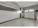 Clean garage with epoxy floors and shelving, ready to use at 2219 E Galileo Dr, Gilbert, AZ 85298