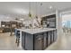 Open concept kitchen with island, stainless steel appliances, and pendant lighting at 2219 E Galileo Dr, Gilbert, AZ 85298