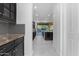 Hallway view to the kitchen with oversized island and custom black cabinetry at 2219 E Galileo Dr, Gilbert, AZ 85298