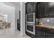 Gourmet kitchen showcasing stainless steel double ovens and custom cabinetry at 2219 E Galileo Dr, Gilbert, AZ 85298