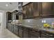 Gourmet kitchen with granite countertops, custom cabinetry, and professional-grade appliances at 2219 E Galileo Dr, Gilbert, AZ 85298
