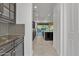 Elegant kitchen with dark cabinetry, mosaic backsplash, stainless appliances, and granite counters at 2219 E Galileo Dr, Gilbert, AZ 85298