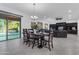 Open-concept living room featuring a large patio door and view of the pool at 2219 E Galileo Dr, Gilbert, AZ 85298