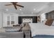 Bright main bedroom with built-in shelving, sitting area, and serene decor create a peaceful retreat at 2219 E Galileo Dr, Gilbert, AZ 85298