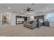 Expansive main bedroom suite features a sitting area, ceiling fan and a large built-in bookcase at 2219 E Galileo Dr, Gilbert, AZ 85298
