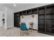 Bright home office featuring custom built-in shelves, task lighting, and a stylish chair for productivity at 2219 E Galileo Dr, Gilbert, AZ 85298