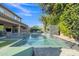 Backyard pool area with a water feature, seating area, and beautiful landscaping at 2219 E Galileo Dr, Gilbert, AZ 85298