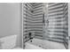 Modern bathroom with a tiled shower, glass door, and stylish fixtures at 2219 E Galileo Dr, Gilbert, AZ 85298