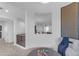 Stylish sitting area overlooking railing features interesting wall decor, seating, and accent table at 2219 E Galileo Dr, Gilbert, AZ 85298