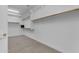 Spacious walk-in closet with carpet and built in shelving and racks for organized storage at 2219 E Galileo Dr, Gilbert, AZ 85298