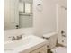 Bright bathroom featuring a shower, sink, and toilet at 2227 N 57Th Dr, Phoenix, AZ 85035