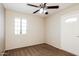 Bedroom with ceiling fan, neutral paint, and carpet at 2227 N 57Th Dr, Phoenix, AZ 85035