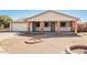 Charming single-story home featuring a covered porch with brick columns and a well-maintained front yard at 2227 N 57Th Dr, Phoenix, AZ 85035