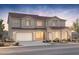 Two-story home with desert landscaping, a two car garage, and a welcoming front entrance at 22458 E San Tan Blvd, Queen Creek, AZ 85142