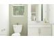 Clean bathroom with toilet, modern vanity and window at 23146 E Lords Way, Queen Creek, AZ 85142