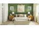 Stylized bedroom with accent wall, large bed, and bench seating in front of the bed at 23146 E Lords Way, Queen Creek, AZ 85142