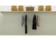 Closet space with hanging shirts and bags at 23146 E Lords Way, Queen Creek, AZ 85142
