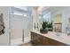 Modern bathroom with a double vanity, spacious shower, and elegant fixtures, offering a spa-like experience at 23334 W Mobile Ln, Buckeye, AZ 85326
