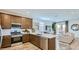 Modern kitchen with stainless steel appliances, sleek countertops, and a kitchen island at 23334 W Mobile Ln, Buckeye, AZ 85326