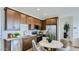 Contemporary kitchen with stainless steel appliances, sleek cabinetry, and a cozy breakfast nook at 23334 W Mobile Ln, Buckeye, AZ 85326