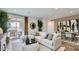 Inviting living room featuring a plush sectional sofa and seamless access to the outdoor patio at 23334 W Mobile Ln, Buckeye, AZ 85326