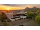 Luxury desert home featuring an outdoor living space, a pool with water feature, and a backdrop of scenic mountains at 24200 N Alma School Rd # 7, Scottsdale, AZ 85255