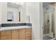 Modern bathroom featuring a glass-enclosed shower, stylish vanity, and ample lighting for a bright space at 24200 N Alma School Rd # 7, Scottsdale, AZ 85255