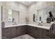 Elegant bathroom with dual sinks, patterned tile walls, and a walk-in closet in a modern home at 24200 N Alma School Rd # 7, Scottsdale, AZ 85255