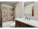 Bathroom featuring a modern vanity, decorative backsplash, and tile surround tub with shower at 24200 N Alma School Rd # 7, Scottsdale, AZ 85255