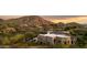 Luxury home featuring stunning mountain views and modern architecture, nestled in a desert landscape at 24200 N Alma School Rd # 7, Scottsdale, AZ 85255