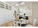 Spacious eat-in kitchen offers stainless steel appliances, a center island, and white custom cabinetry at 24200 N Alma School Rd # 7, Scottsdale, AZ 85255