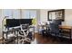 Spacious home office with hardwood floors, dual workstations, modern chairs, and bright natural light at 24200 N Alma School Rd # 7, Scottsdale, AZ 85255