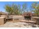 Inviting outdoor fireplace and grill area, perfect for entertaining in a serene desert setting at 24200 N Alma School Rd # 7, Scottsdale, AZ 85255
