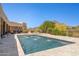 Inviting pool with a water feature and travertine surround, set against desert landscaping and mountain views at 24200 N Alma School Rd # 7, Scottsdale, AZ 85255