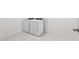 This laundry room features a brand-new, efficient washer and dryer set with matching neutral flooring at 25438 W Chipman Rd, Buckeye, AZ 85326