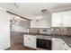 Open floor plan view into kitchen featuring stainless steel range and mosaic backsplash at 2938 N 18Th Ave, Phoenix, AZ 85015
