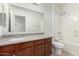 Bathroom featuring a sink with a granite countertop, white toilet and bath and shower combo at 2993 E Meadowview Dr, Gilbert, AZ 85298