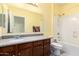 Bathroom showcasing a single sink vanity and shower over tub at 2993 E Meadowview Dr, Gilbert, AZ 85298