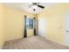 Bedroom featuring a ceiling fan, window, and large closet at 2993 E Meadowview Dr, Gilbert, AZ 85298