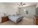 Cozy bedroom with soft carpet, a ceiling fan, and ample natural light at 2993 E Meadowview Dr, Gilbert, AZ 85298