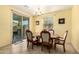 Charming dining room featuring a chandelier, ceramic flooring and a sliding glass door at 2993 E Meadowview Dr, Gilbert, AZ 85298