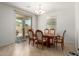 Elegant dining room featuring a chandelier and sliding door access to the backyard at 2993 E Meadowview Dr, Gilbert, AZ 85298