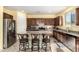 Modern kitchen with stainless steel appliances and an island featuring barstool seating at 2993 E Meadowview Dr, Gilbert, AZ 85298