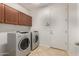 Laundry room featuring a full size washer and dryer with overhead cabinets at 2993 E Meadowview Dr, Gilbert, AZ 85298