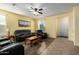 Cozy living room with tile and wood flooring and yellow walls providing warmth at 2993 E Meadowview Dr, Gilbert, AZ 85298