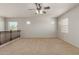 This living room features neutral carpeting and railing at 2993 E Meadowview Dr, Gilbert, AZ 85298