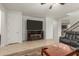 Comfortable living area with entertainment center, fireplace, and neutral tiled flooring at 2993 E Meadowview Dr, Gilbert, AZ 85298