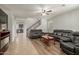 Spacious living room featuring tile and wood floors, with staircase and kitchen views at 2993 E Meadowview Dr, Gilbert, AZ 85298