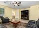 Comfortable living room featuring a tv console, ceiling fan and ceramic tile flooring at 2993 E Meadowview Dr, Gilbert, AZ 85298