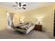Spacious main bedroom with a ceiling fan and view of the ensuite bathroom at 2993 E Meadowview Dr, Gilbert, AZ 85298